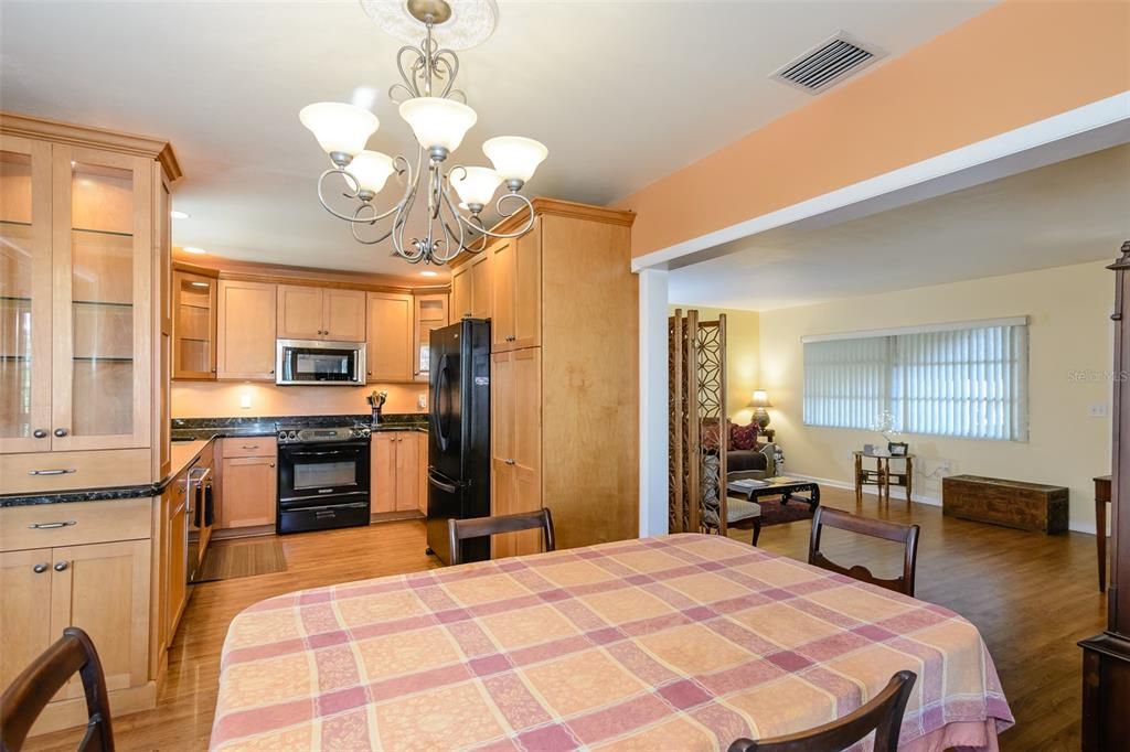 The view from the dining room shows the kitchen and living room layout.