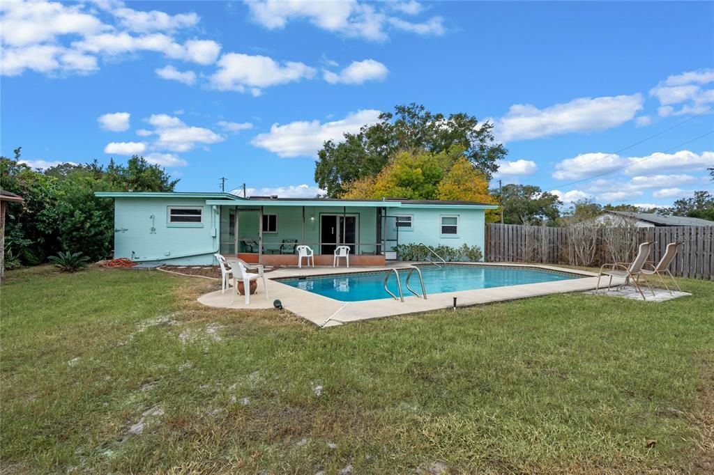 Large fenced backyard with pool