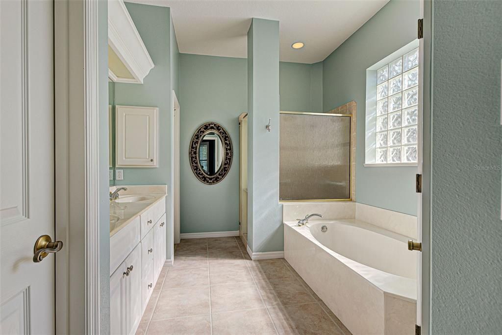 Spacious, light and bright ensuite bathroom.