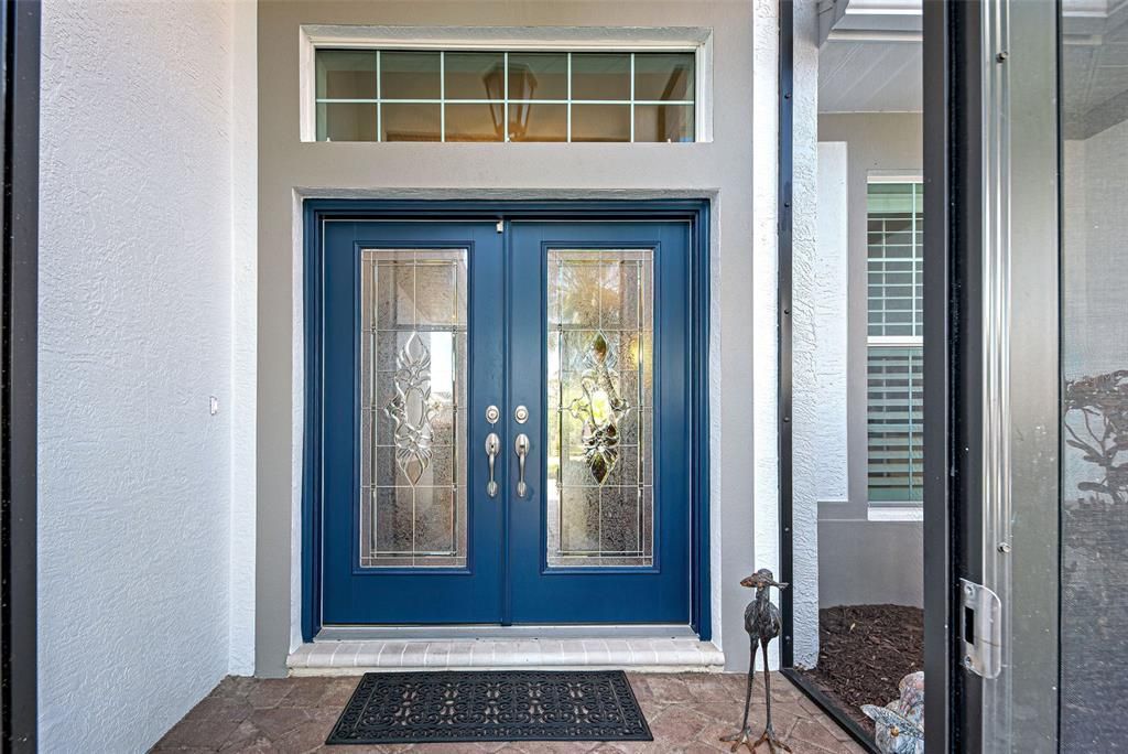 Welcoming, screened in and covered entry way.