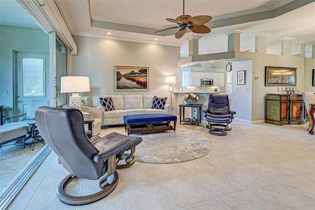 Great room flows seamlessly to the kitchen and dining room.  Tall ceilings and architectural features make this home really shine.