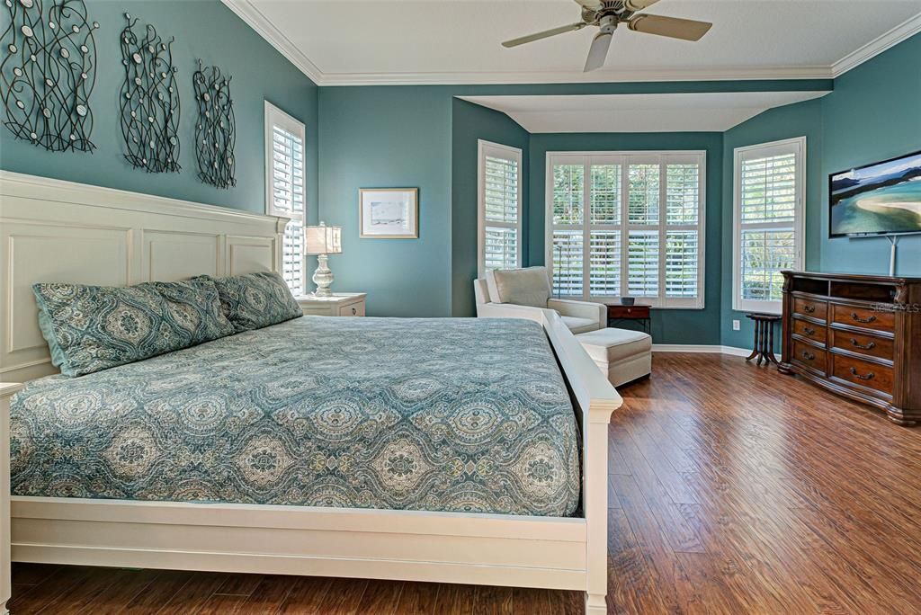 Plantation shutters, luxury vinyl plank floring and crown molding make it a true retreat.