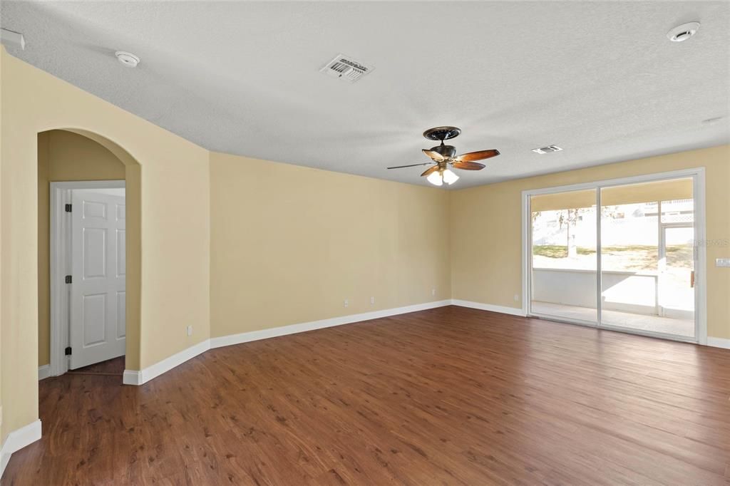 Upstairs living room with sliding glass doors to screened back porch