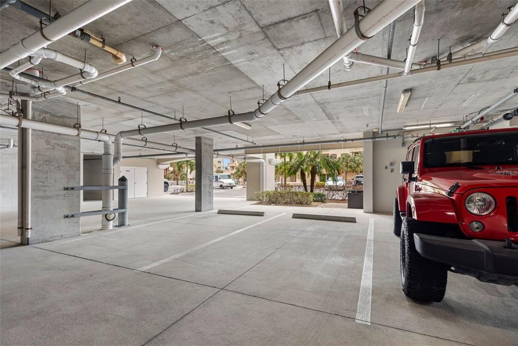 One under bldg covered parking space next to entrance