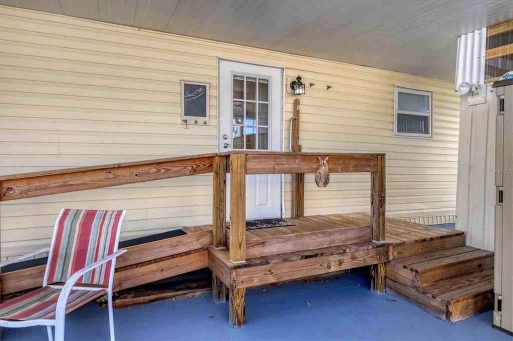 Entrance from carport with easy access ramp and stairs