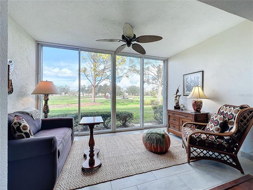 Primary bedroom with view to golf course