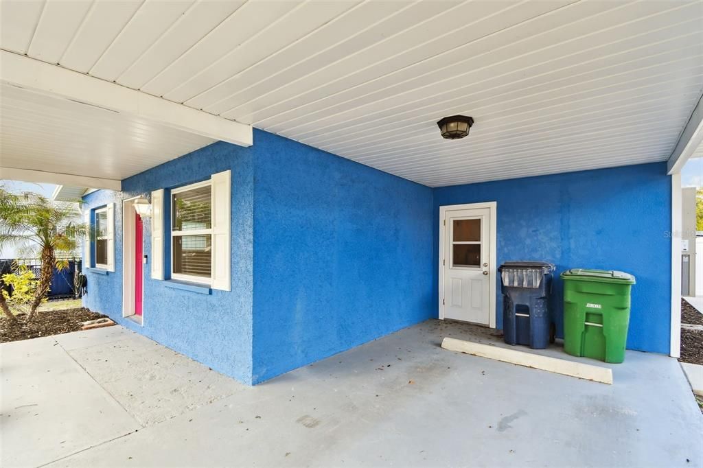 Carport with Entrance to Laundry Room and Storage