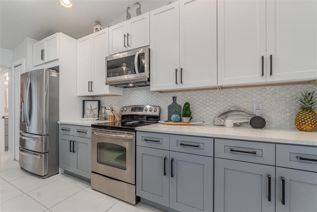 Two Tone cabinets in kitchen Quartz countertops