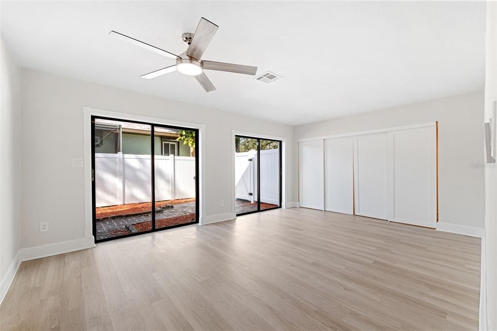 Downstairs renovated master bedroom with private entrance and wall to wall closets