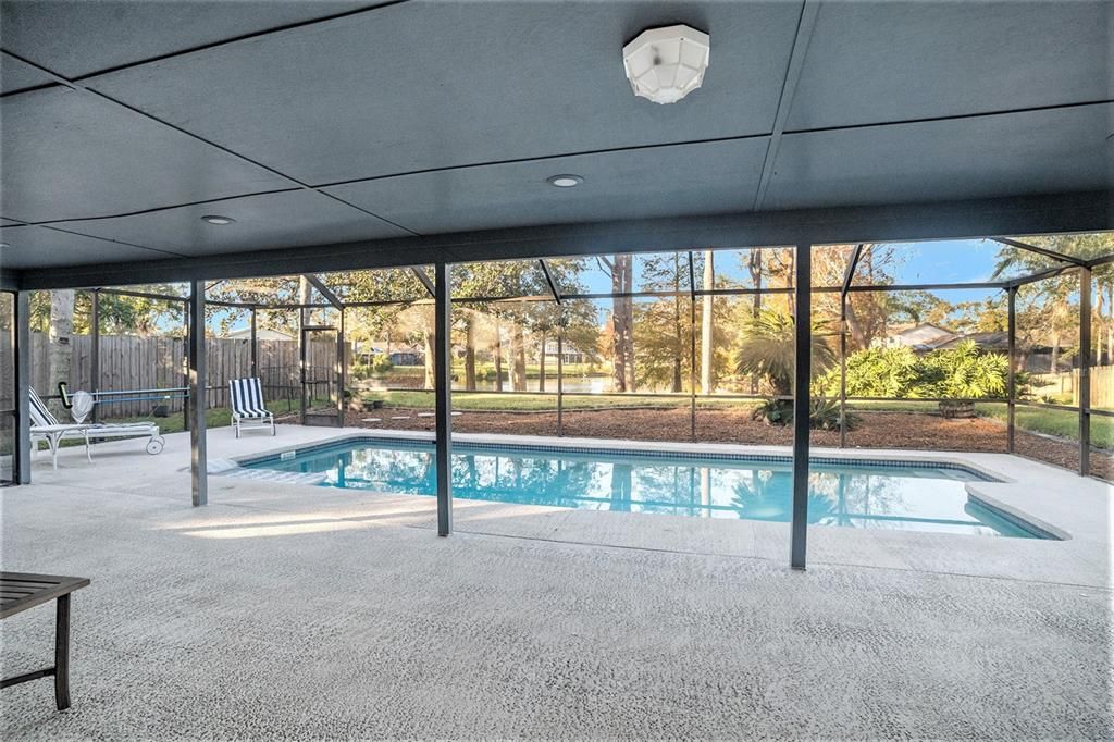 View of pool and lake standing in great room