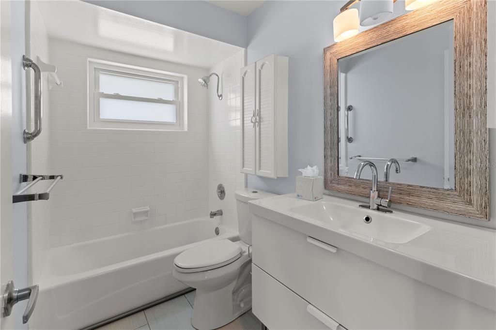 Second bathroom - single sink and tub