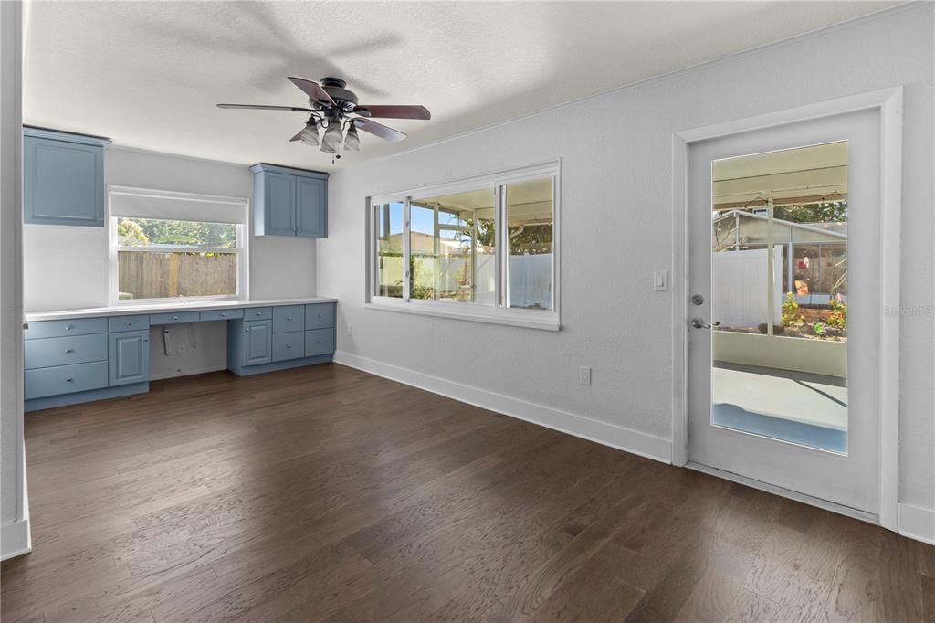 Florida/family room with built in cabinets & desk