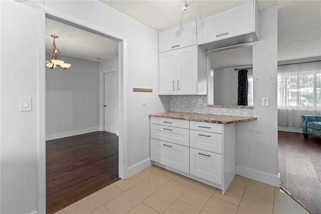 Kitchen has walk-thru to dining room and living room (located in center of home)