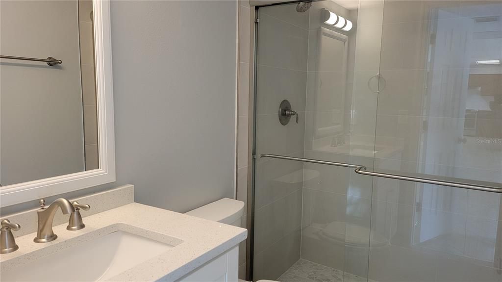 En suite bathroom with large walk in shower