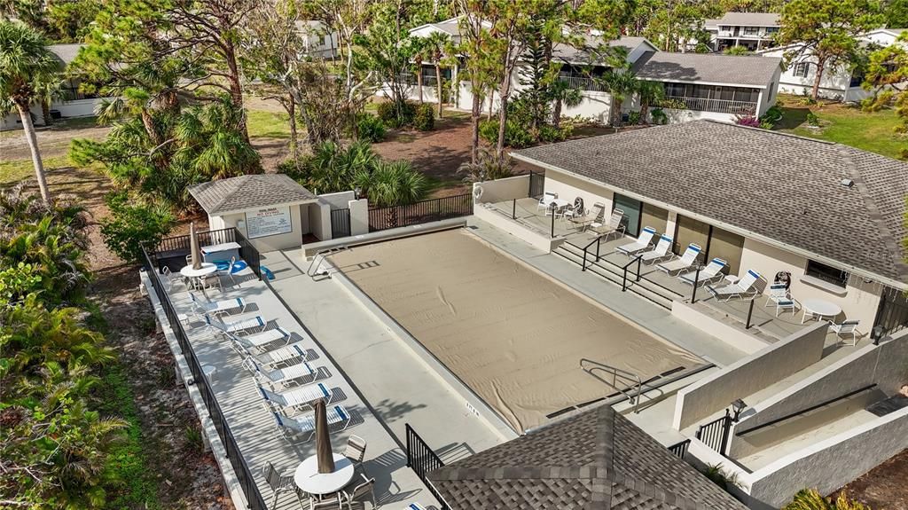 COMMUNITY POOL THE NEW COVER HELPS KEEP  THE POOL CLEAN, SAVES ON HEAT AND IS MOTORIZED FOR EASY REMOVAL