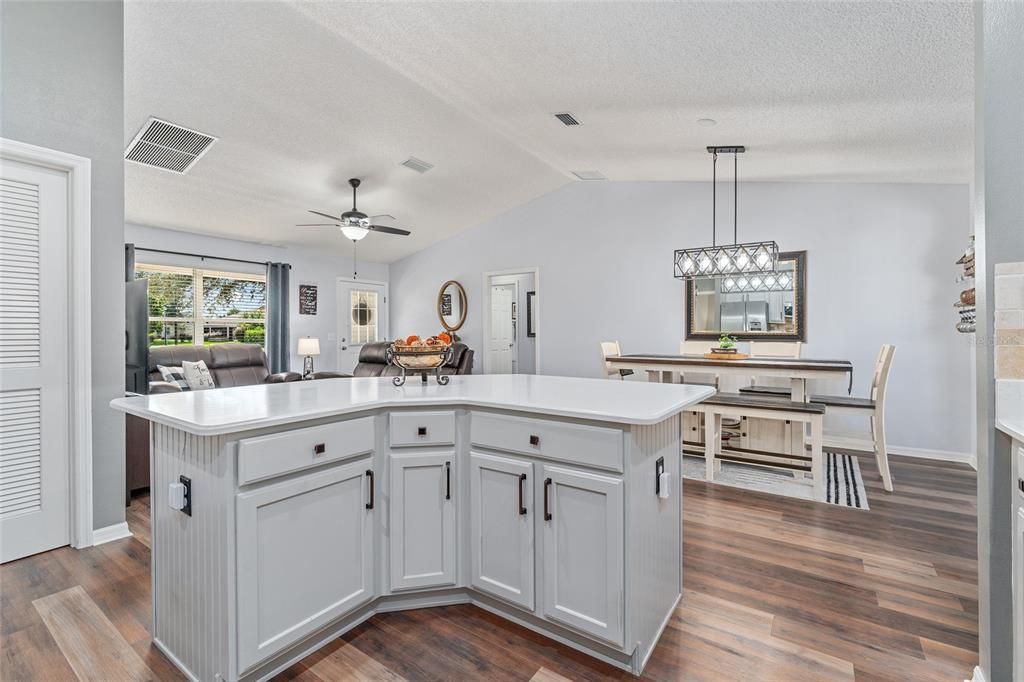 View from KITCHEN - Looking out towards LR & DR, Louvered Door (L) leads to INTERIOR LAUNDRY and POCKET DOOR provides privacy for GUEST WING (back center).