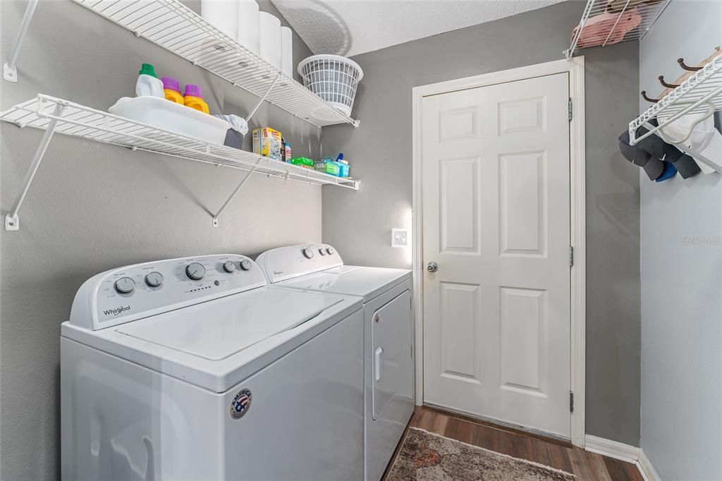 INTERIOR LAUNDRY ROOM - Access door (R) to garage