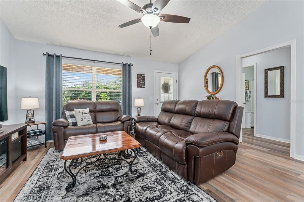 Another view of LIVING ROOM - shows GUEST WING entrance with POCKET DOOR (R) for privacy