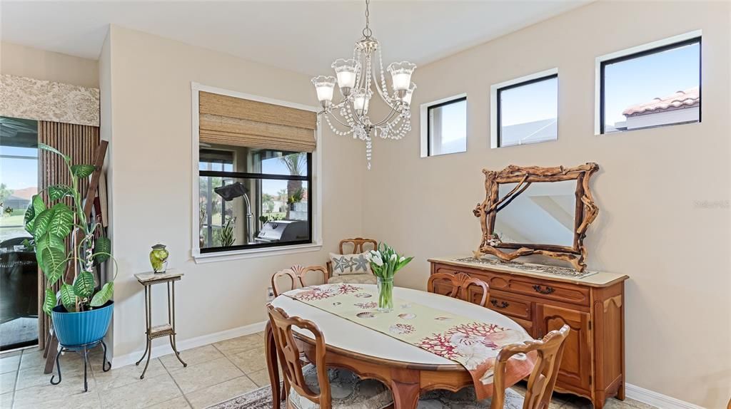 Designated Dining space with a large rear window overlooking the Lanai and casement windows on the wall allowing for abundant light and privacy.