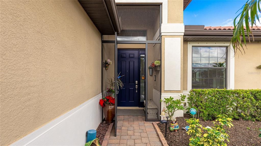 Entry way with enclosed porch perfect for pets  small children and that warm ocean breeze.  There is an additional sliding door screen inside the front door for additional safety.