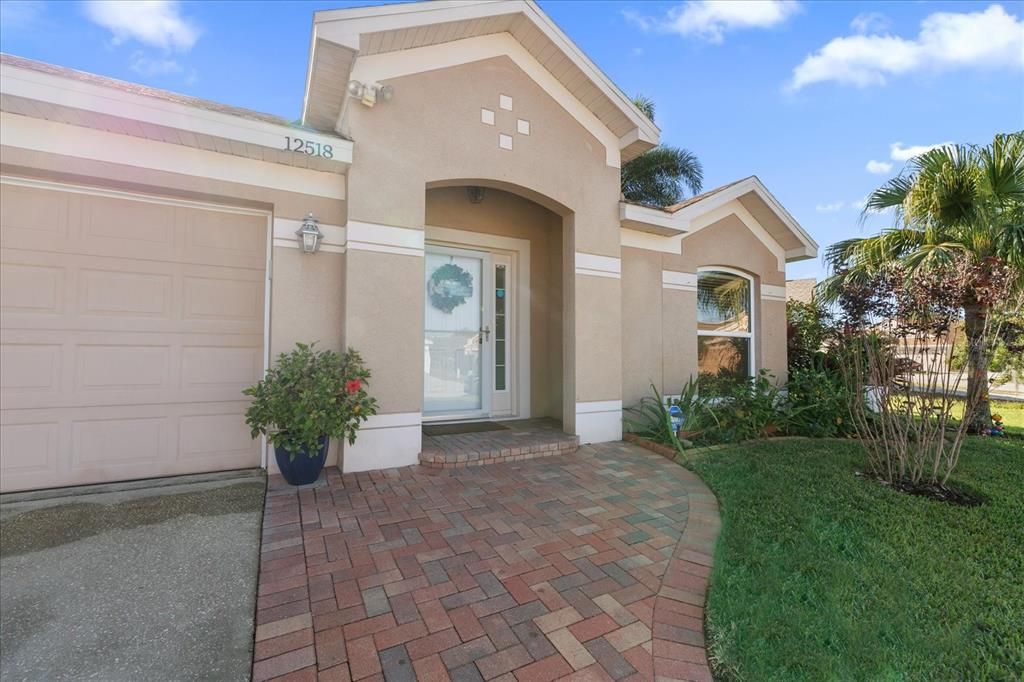 Pavers to Front Door with a Clear Storm Door