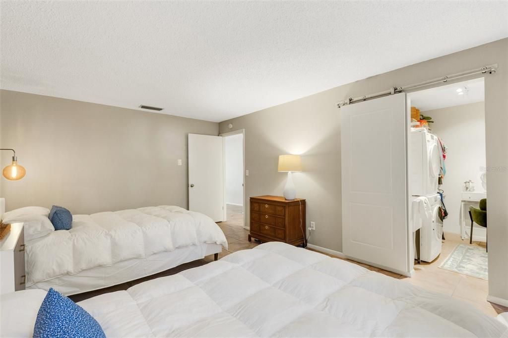 Bedroom With Washer Dryer and Makeup Area in Walk in Closet