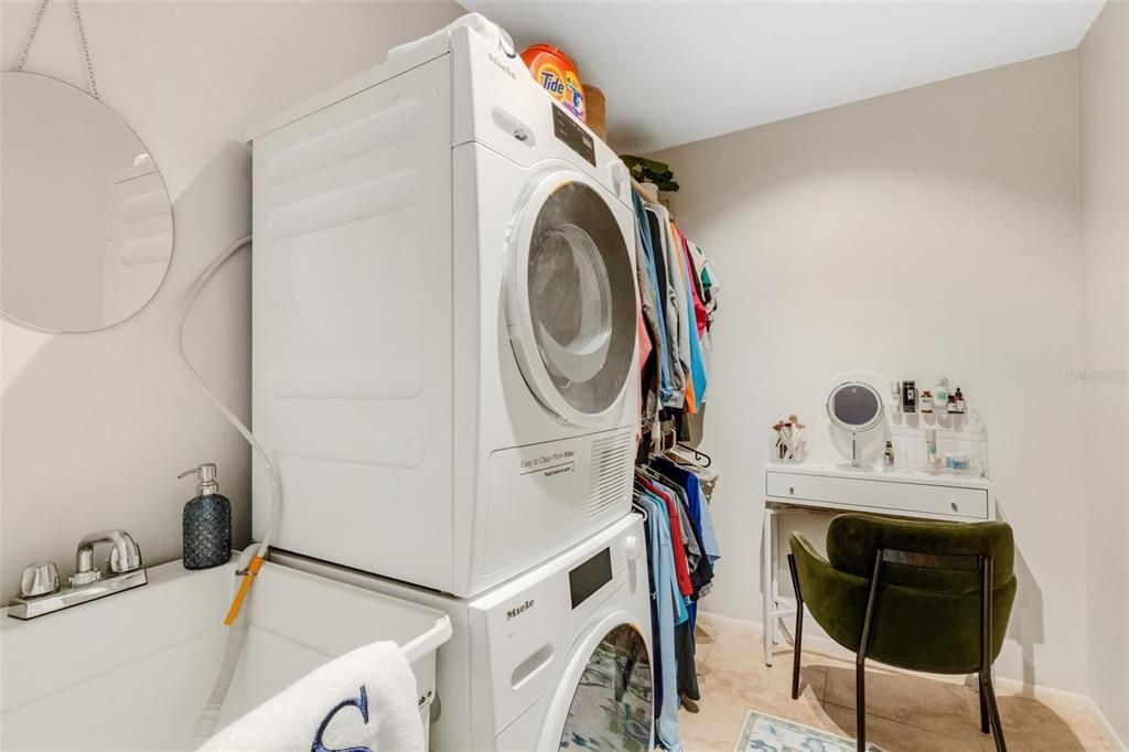 Walk in Closet with Mop Sink, Washer/Dryer and Makeup area.