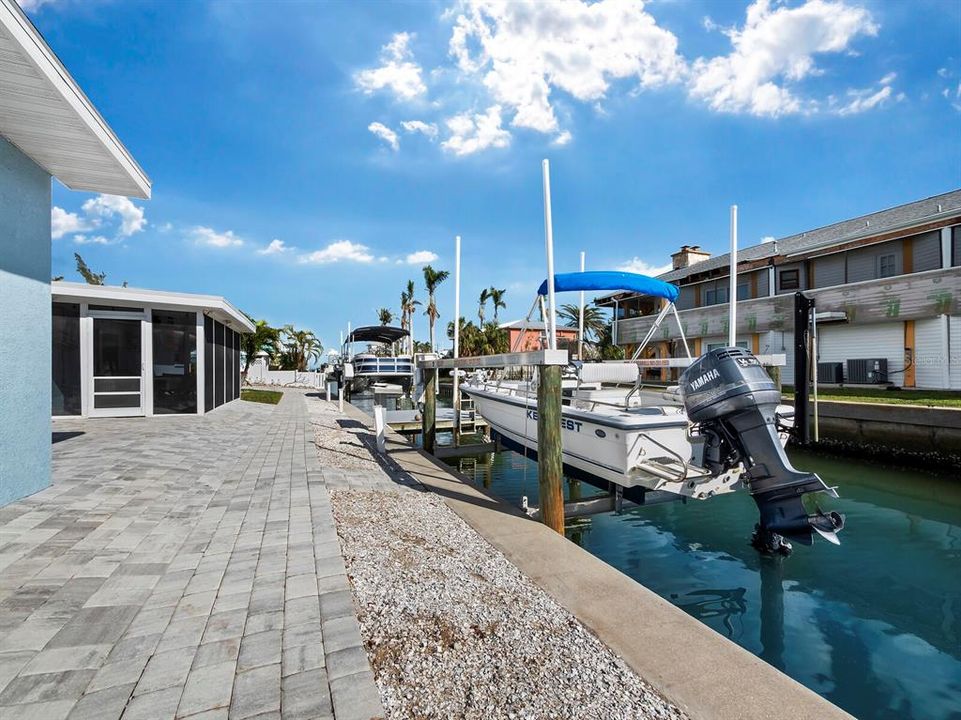 Outside -- Shows pavers, dock, lifts