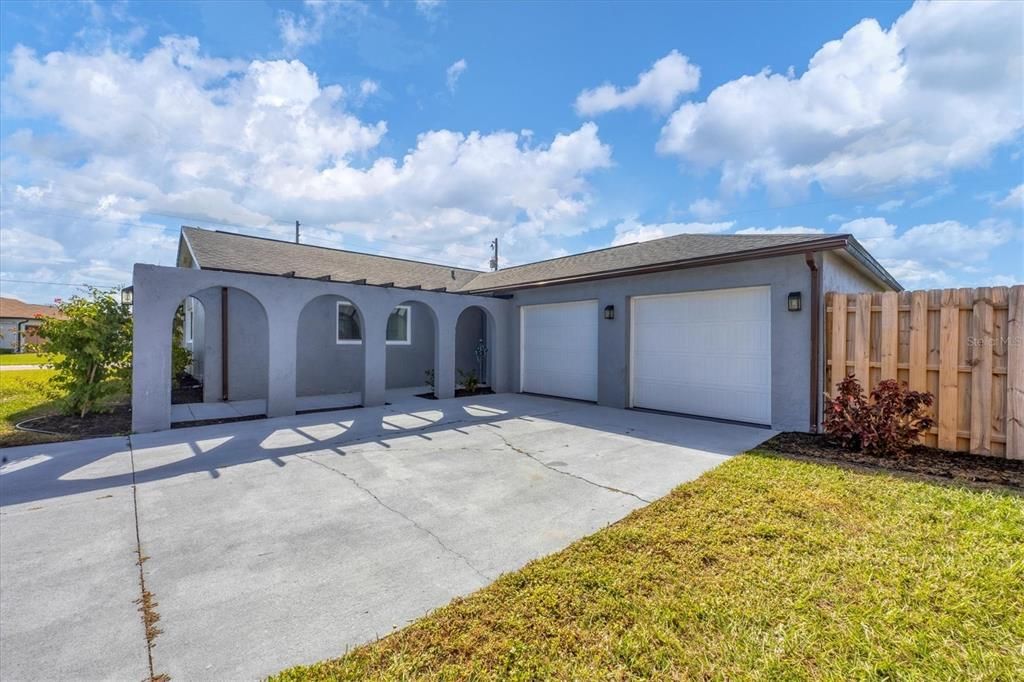 New dual garage doors, hurricane rated, with solar lighting