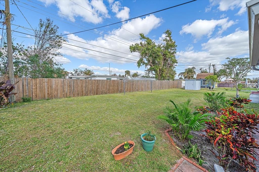 Exit patio to lovely backyard