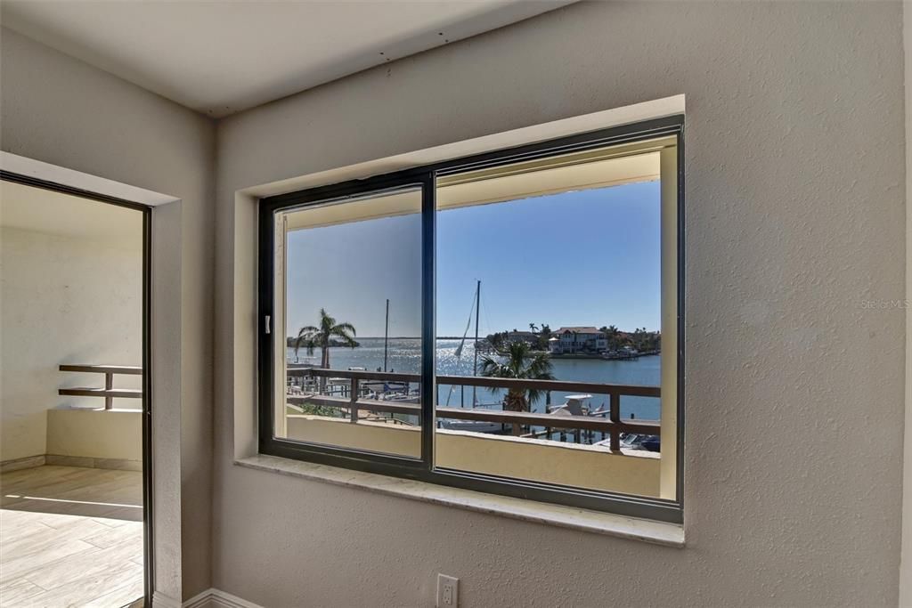 View through window in living area and patio doors out to balcony