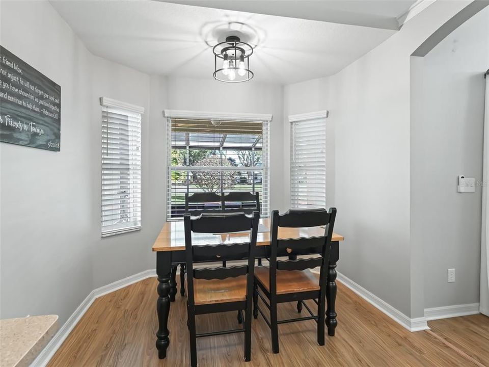 Eat in area of kitchen w/Designer light fixture