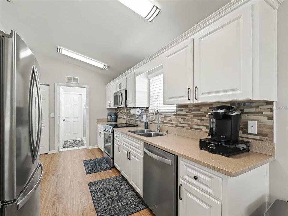 Kitchen w/Quartz countertops & laminate