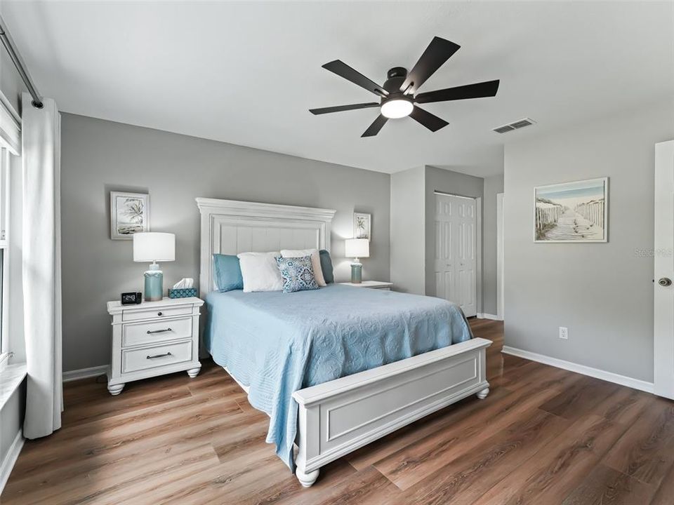 Primary bedroom w/Luxury Vinyl Plank flooring