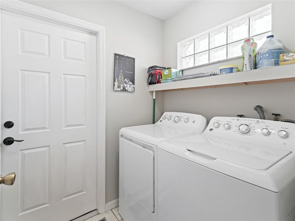 Inside laundry rm w/extra shelving