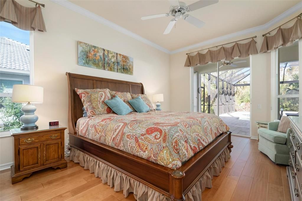 Primary bedroom with slider to lanai/pool