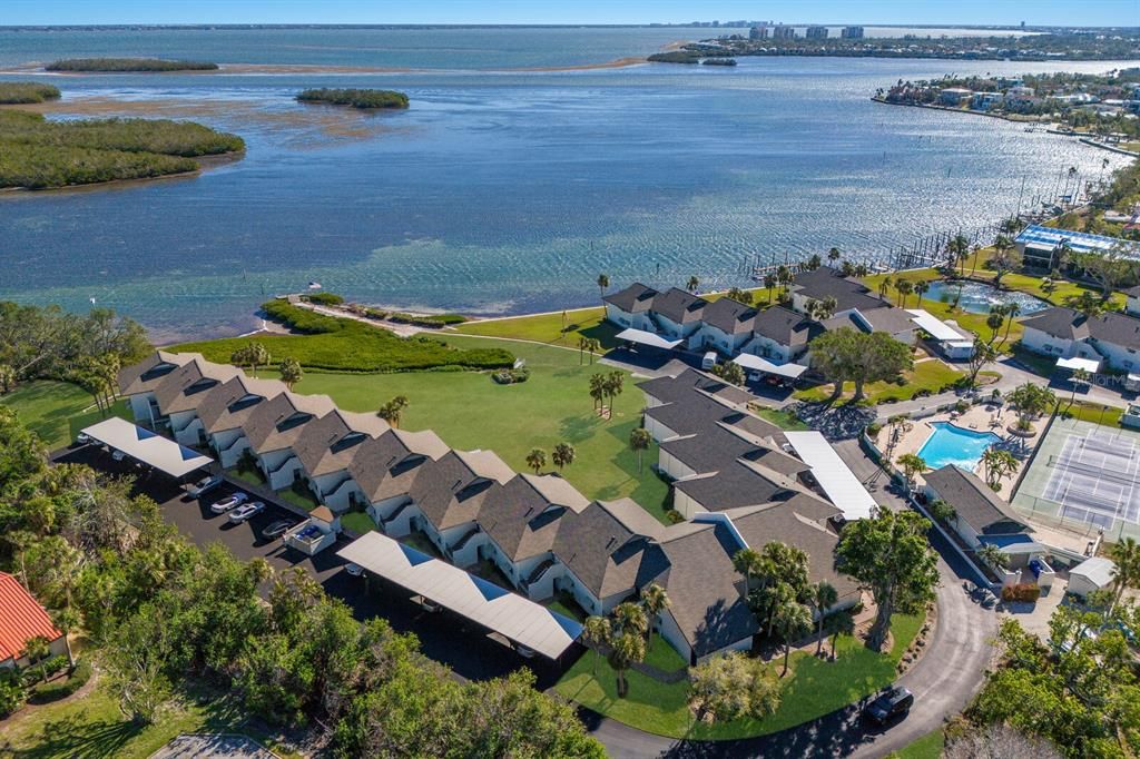 Resort pool, pickleball, and tennis court in view