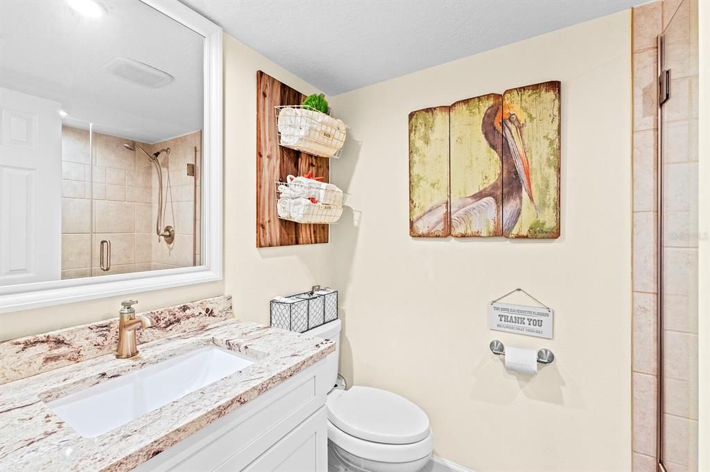 Second bath with walk-in shower adjoins guest suite