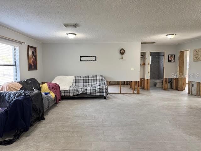 Living room and kitchen area view towards the front entrance