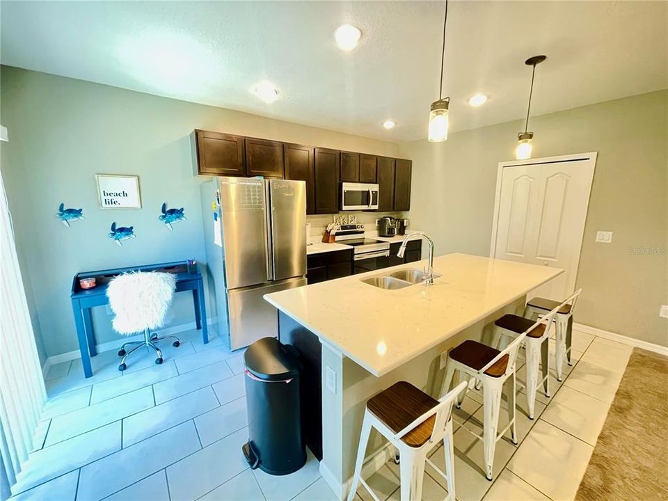 Gorgeous Eat-in kitchen with stainless steel appliances, wood cabinets, and huge pantry!  Must see!!