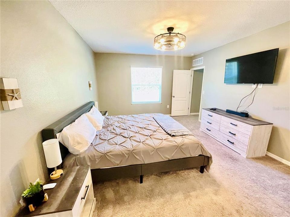 Primary BedroomSpacious with ceiling fan, walk-in closet and en suite bathroom