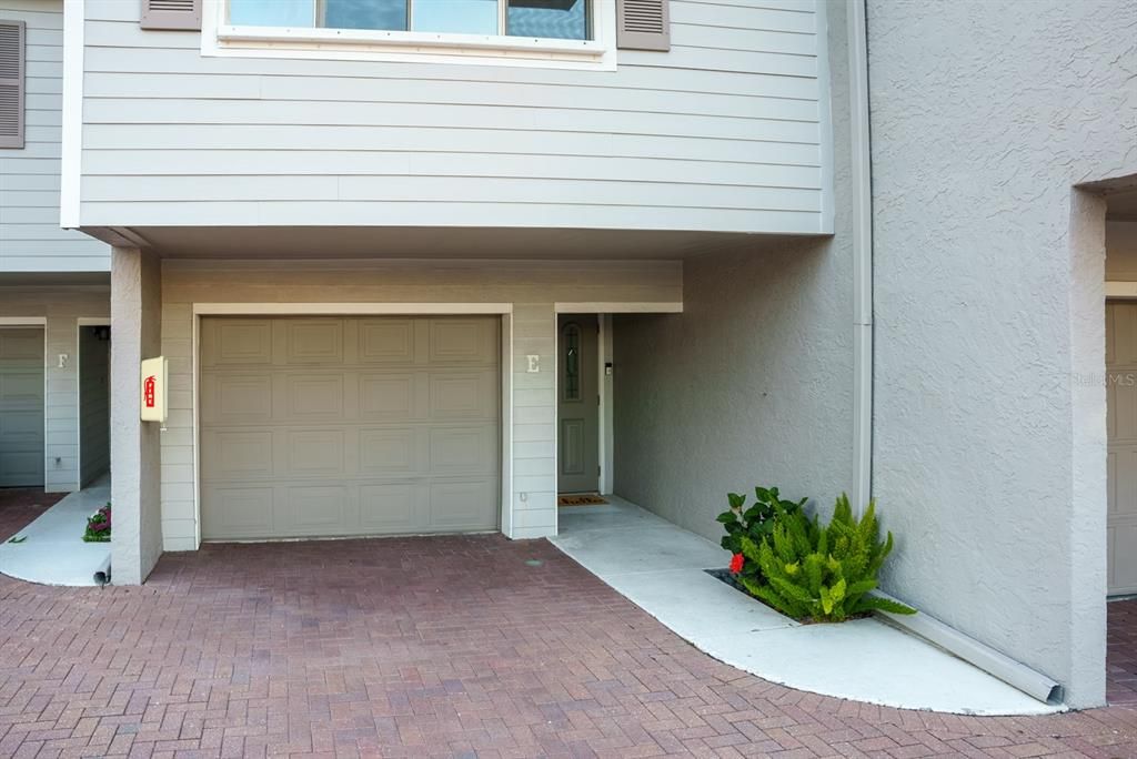 One car garage with additional parking behind the garage and an assigned spot too!