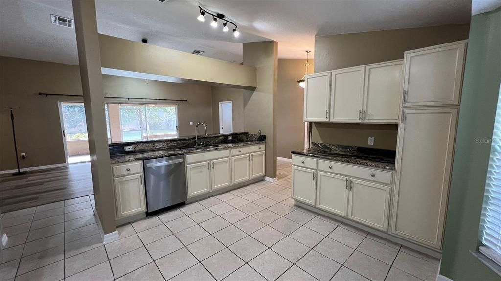 Kitchen with large island overlooking living