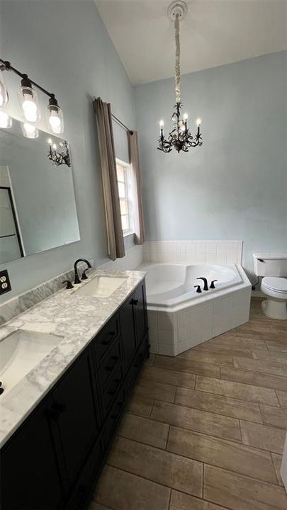 Double vanity and soaking tub in Primary bathroom