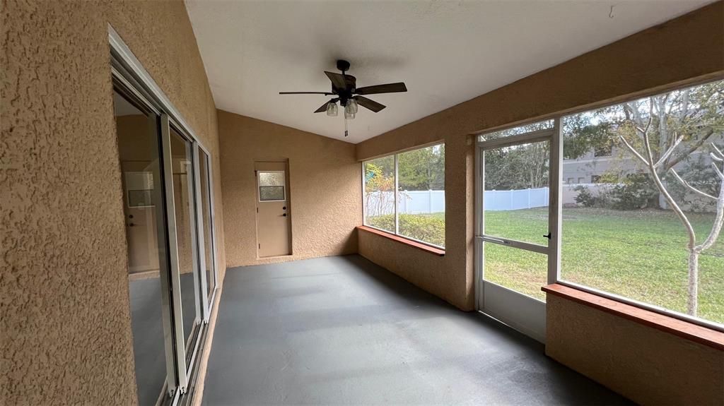 Screened porch overlooking large backyard