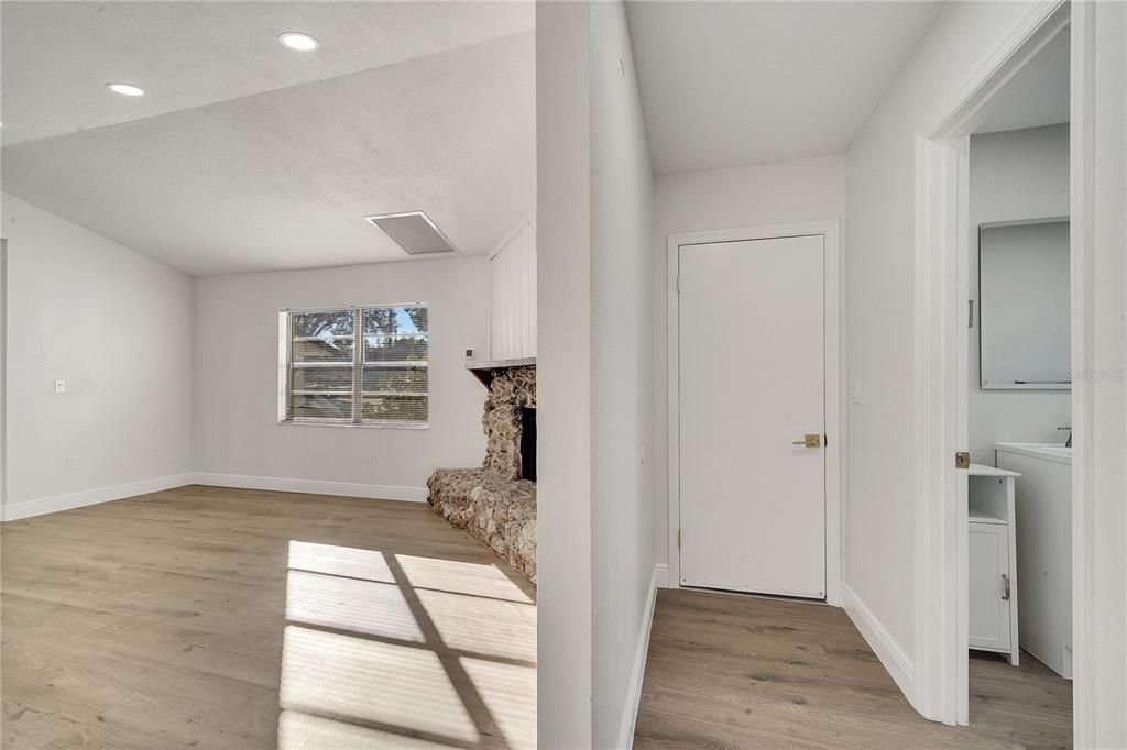 Hallway to the second bathroom and garage