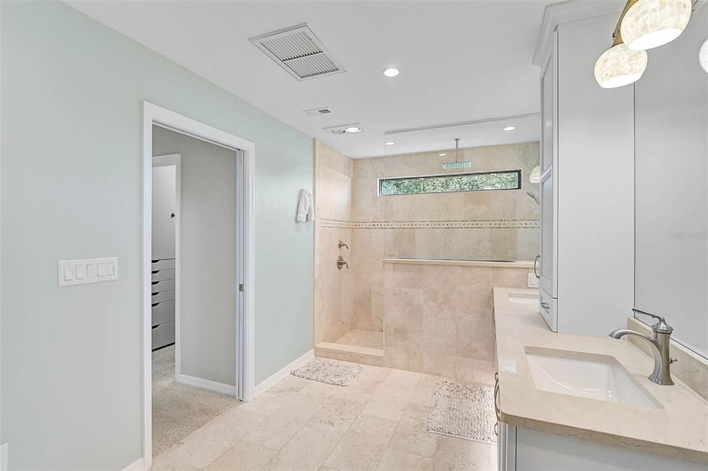 Primary Bath, with a peek into one of the Primary Bedroom closets