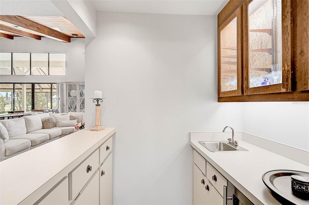 Wet bar, with a refrigerator below