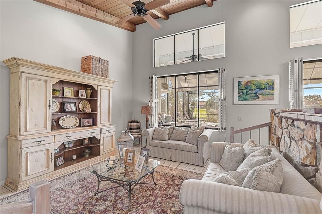 Another view of the living room, sliding windows to the pool area.