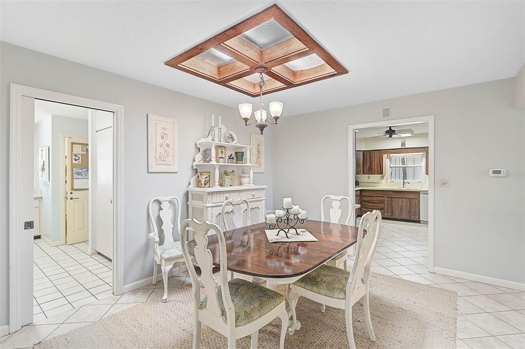 Breakfast room, peeking into the kitchen.  The spacious laundry room is behind the pocket door, and leads to the garage